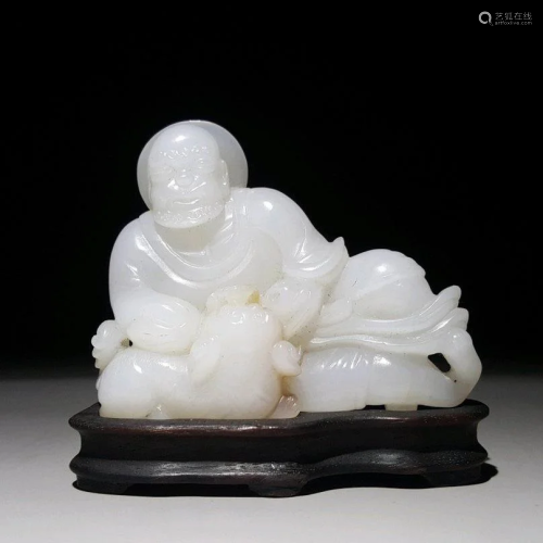 A CHINESE CARVED HETIAN JADE ARHAT ORN…