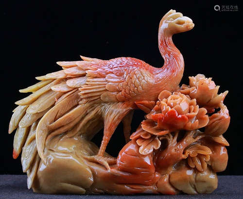 A SOAPSTONE CARVED PHOENIX SHAPED ORNAMENT