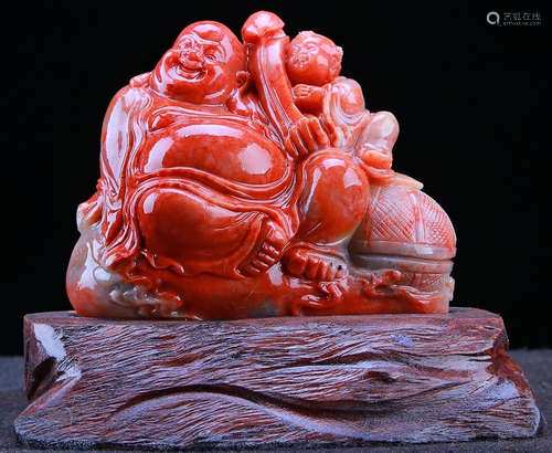 A SOAPSTONE CARVED MAITREYA BUDDHA STATUE