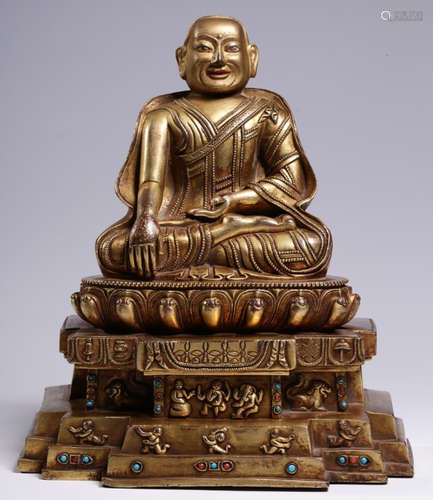 A GILT BRONZE WITH GEM DECORATED BUDDHA STATUE