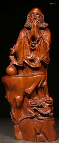 A HUANGYANG WOOD CARVED ARHAT STATUE