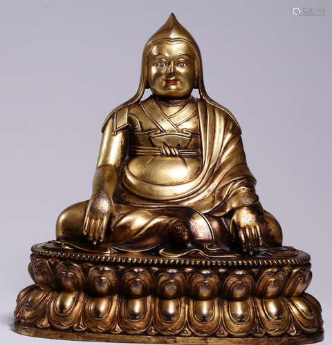 A GILT BRONZE CAST TSONGKAHAPA STATUE