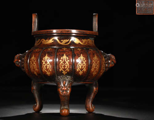 A GILT BRONZE CAST SCROLL PATTERN CENSER