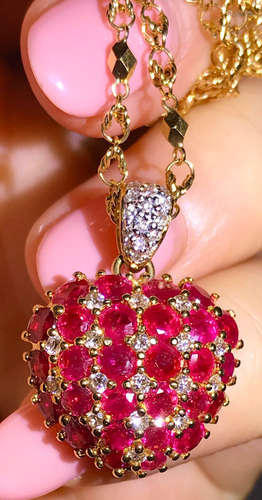 A 18K RUBY DIAMOND PENDANT