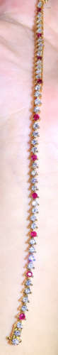 A 18K GOLD RUBY DIAMOND BRACELET