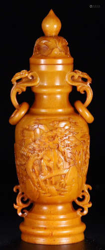 A YELLOW JADE CARVED FIGURE PATTERN VASE