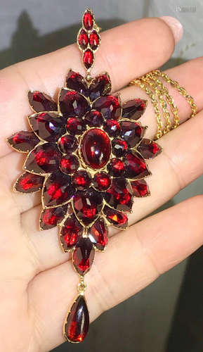 A 14K GARNET PENDANT