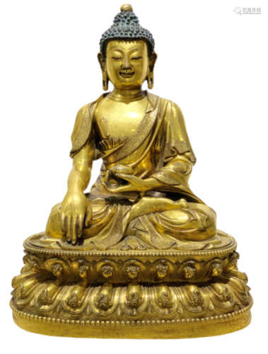 Statuette of Buddha Sakyamuni in gilt bronze.