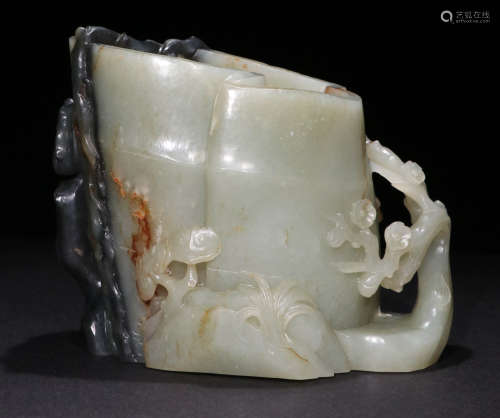 A Qing dynasty carved Hetian Jade Brush Pot