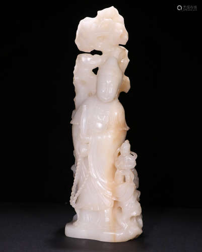 A Qing dynasty Carved Hetian Jade 
Guanyin Statue