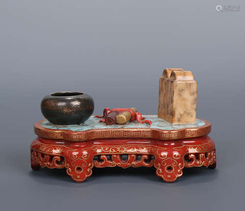 A Qing Dynasty Alum Red Gilt Porcelain Treasures of the Study set