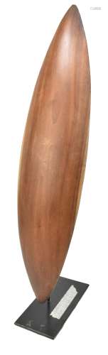 An Australian mulga wood parrying shield carved from a single piece, length 63cm, mounted on a
