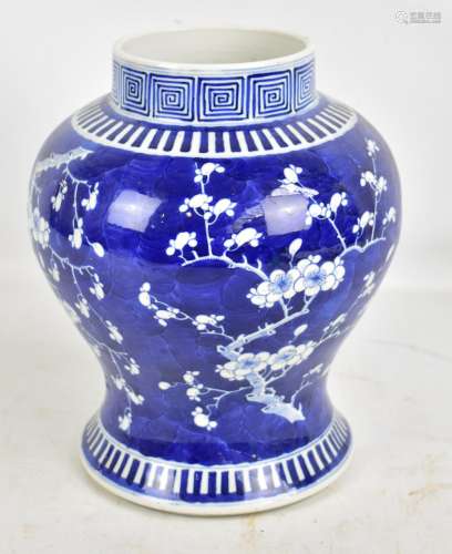 A late 19th/early 20th century Chinese baluster vase painted in underglaze blue with blossoming