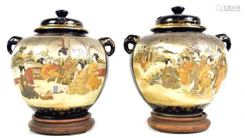 A pair of Japanese Meiji period Satsuma twin handled vases of bulbous form, each painted with geisha