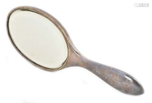 LUEN WO; a Chinese silver dressing table hand mirror, with cast decoration of a prunus tree above