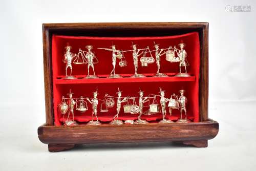 A cased set of twelve Chinese (or Hong Kong) sterling silver menu holders modelled as traditional