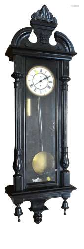 A late 19th/early 20th century Viena style wall clock in ebonised case, the circular enamelled