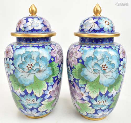 A pair of Chinese cloisonné enamel vases painted with butterflies and floral sprays, on cobalt