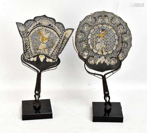 A pair of Indonesian Wayang pierced leather and buffalo horn shadow hand screens on stands, height