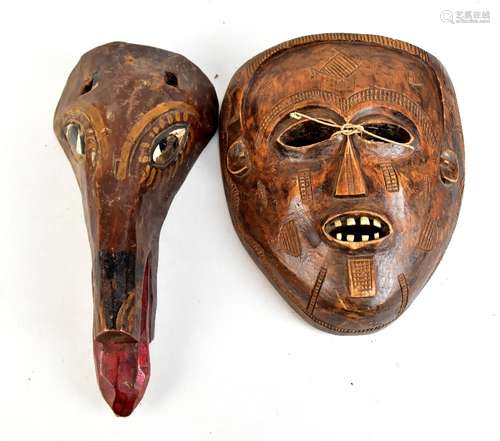 A carved Thai mask with painted detail and a carved African mask, length 31cm and 24cm (2).