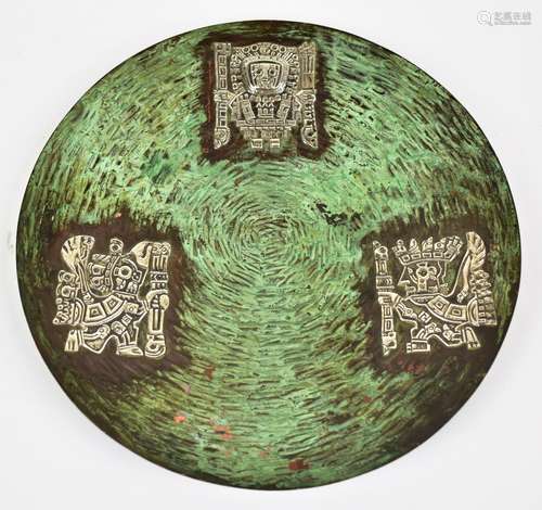 VICKI; a Peruvian beaten copper plate with patinated finish and white metal inlay depicting Inca