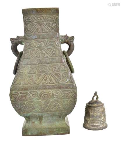 A large Chinese bronze archaistic hu vase with twin chilong head handles suspending rings, with