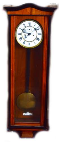A late 19th century walnut and stained beech Vienna style wall clock with two piece white