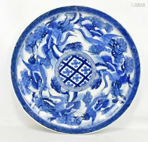 A late 17th/18th century Japanese Arita porcelain charger, painted in underglaze blue with series of