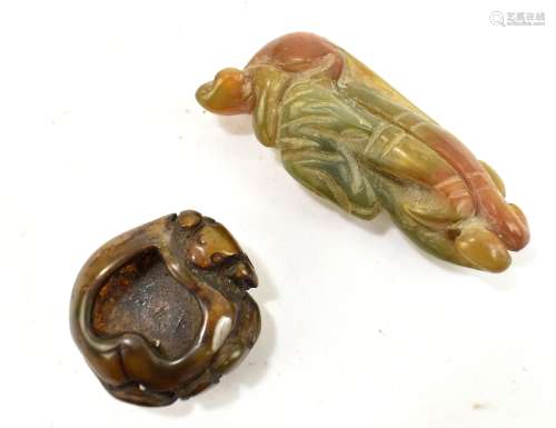 A Chinese jade carving depicting a monkey perched upon a Buddha's hand (or fingered citron) fruit,
