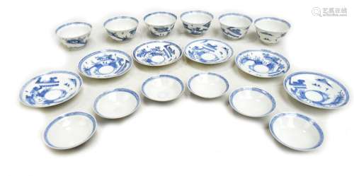 A set of six Japanese porcelain blue and white tea bowls, covers and saucers, painted with landscape