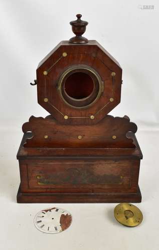 A 19th century rosewood mantel clock, the octagonal upper section enclosing enamelled dial set