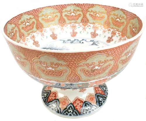 A Japanese Meiji period Imari bowl, the centre painted with landscape in underglaze blue, the