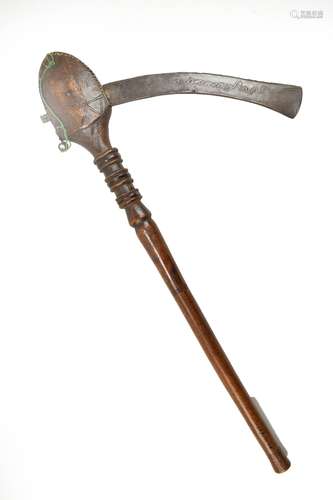 A Mozambique Tsonga ceremonial axe, with wimple decoration to the metal blade and turned wooden