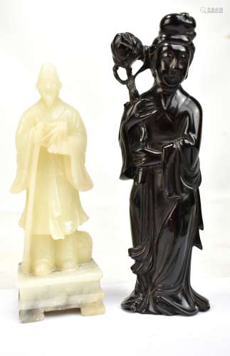 A 20th century Chinese carved soapstone figure depicting a robed official or poet on square