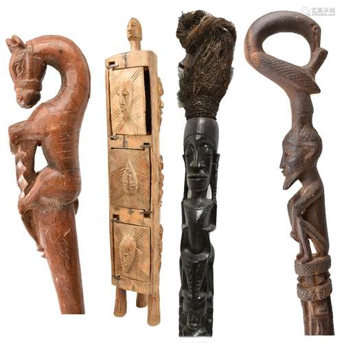 A tall ebonised carved African sectional staff, height approx 180cm, two walking sticks, length 84cm