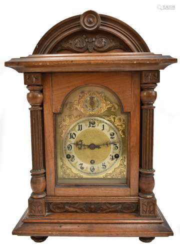 A late 19th/early 20th century mahogany cased bracket clock, the gilded face with chime and silent