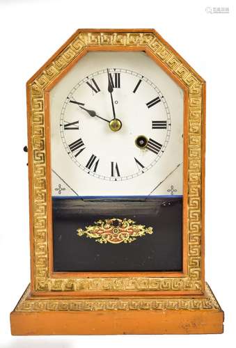 A late 19th century American mantel clock, the circular dial set with Roman numerals, housed