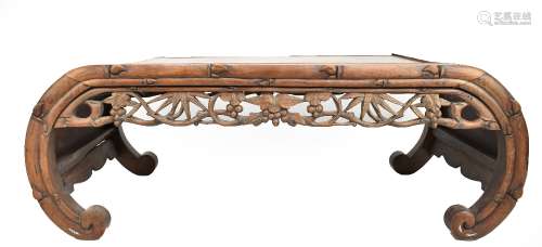 A mid-late 19th century Chinese rosewood low coffee table with carved foliate frieze and further