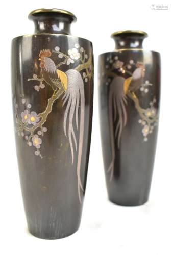 A pair of Japanese Meiji period bronze vases decorated with cockerels perching on a branch beside