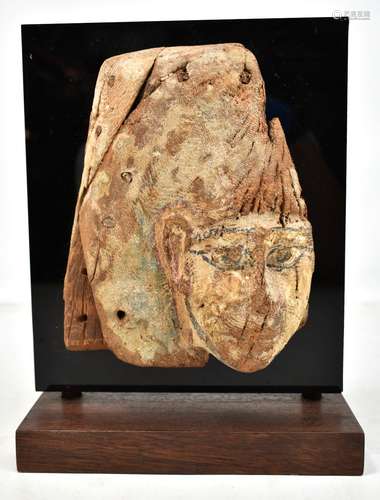 An Egyptian wooden fragment with traces of original painted decoration, 23 x 18cm, now mounted on