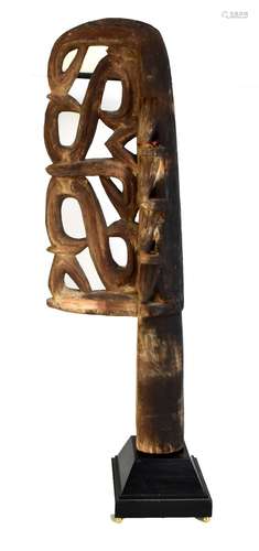 A large pierced sepik canoe prow, now mounted on an ebonised stand, height approx 89cm.