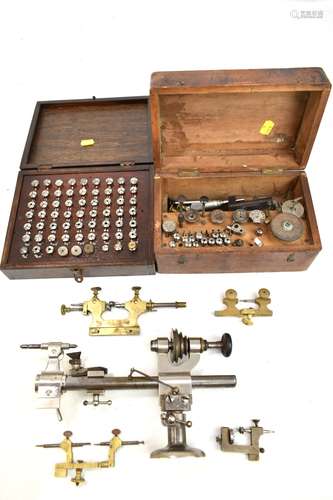 A group of clock manufacturer and repair tools and accessories including G.Boley lathe, clamps,