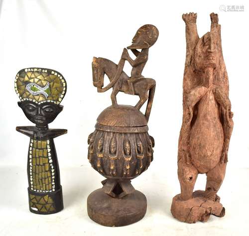 An African tribal wooden bowl and cover with figural surmount, a rustic carving and a metal and