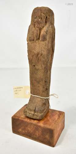 A carved Egyptian wooden Ushabti, height 26.5cm.Additional InformationBears paper label inscribed '