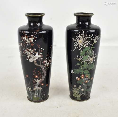 A pair of early 20th century Japanese cloisonné enamelled vases of tapered form, the first featuring