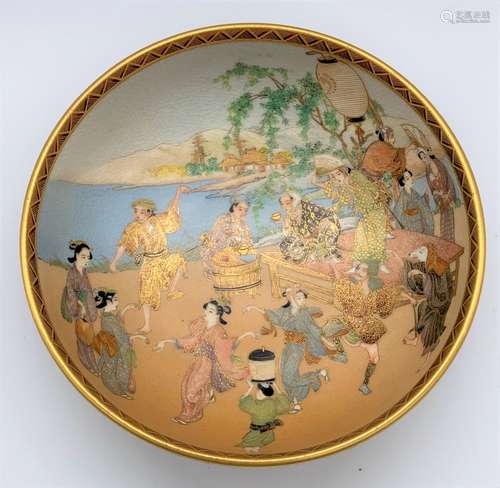 KUSHIDA SHOZAN; a fine Japanese Meiji period Satsuma chawan internally decorated with revellers at a