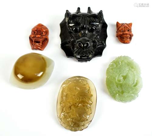 Two Japanese Meiji period ojime beads carved as noh masks, each signed, each 3cm, three carvings and