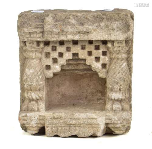 A carved stone fragment with central recess, carved pilasters and molded decoration, height 25.