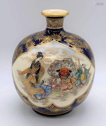 KINKOZAN; a fine Japanese Meiji period Satsuma vase decorated with twin panels, the first with