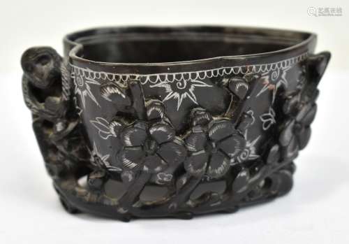 A 20th century Chinese carved black soapstone brush washer featuring monkey, flowering prunus and